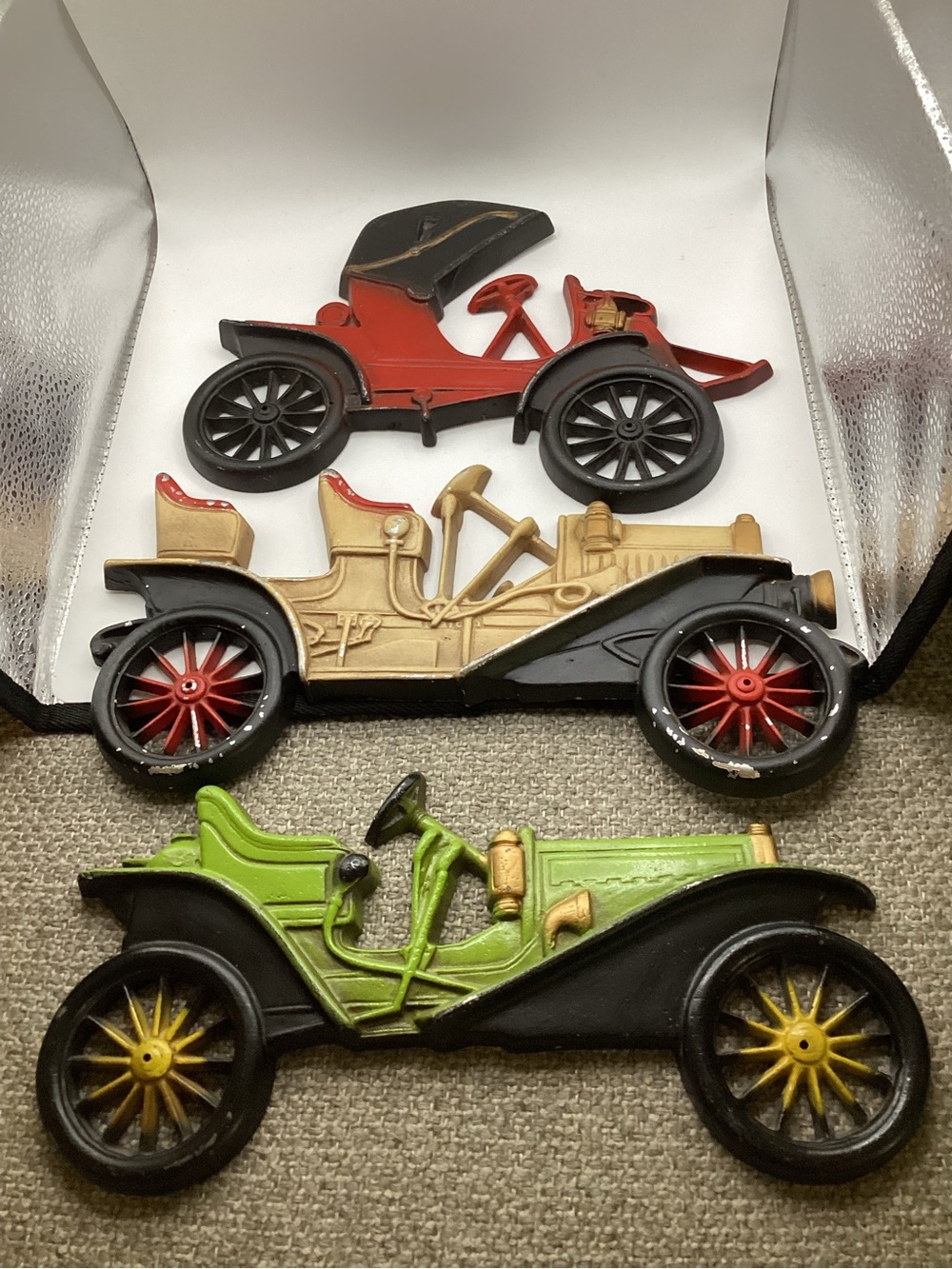Cast aluminum vintage automobile wall plaques crafted by Midwest